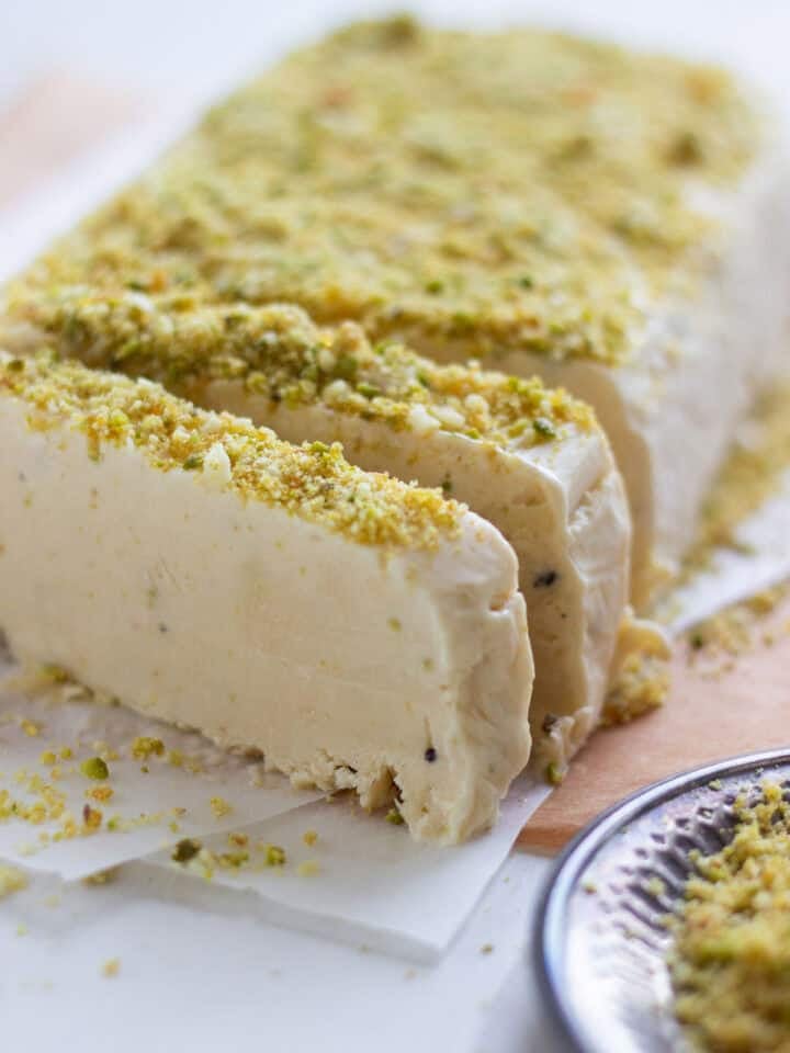 A Kulfi Ice Cream cut into slices and slightly separated