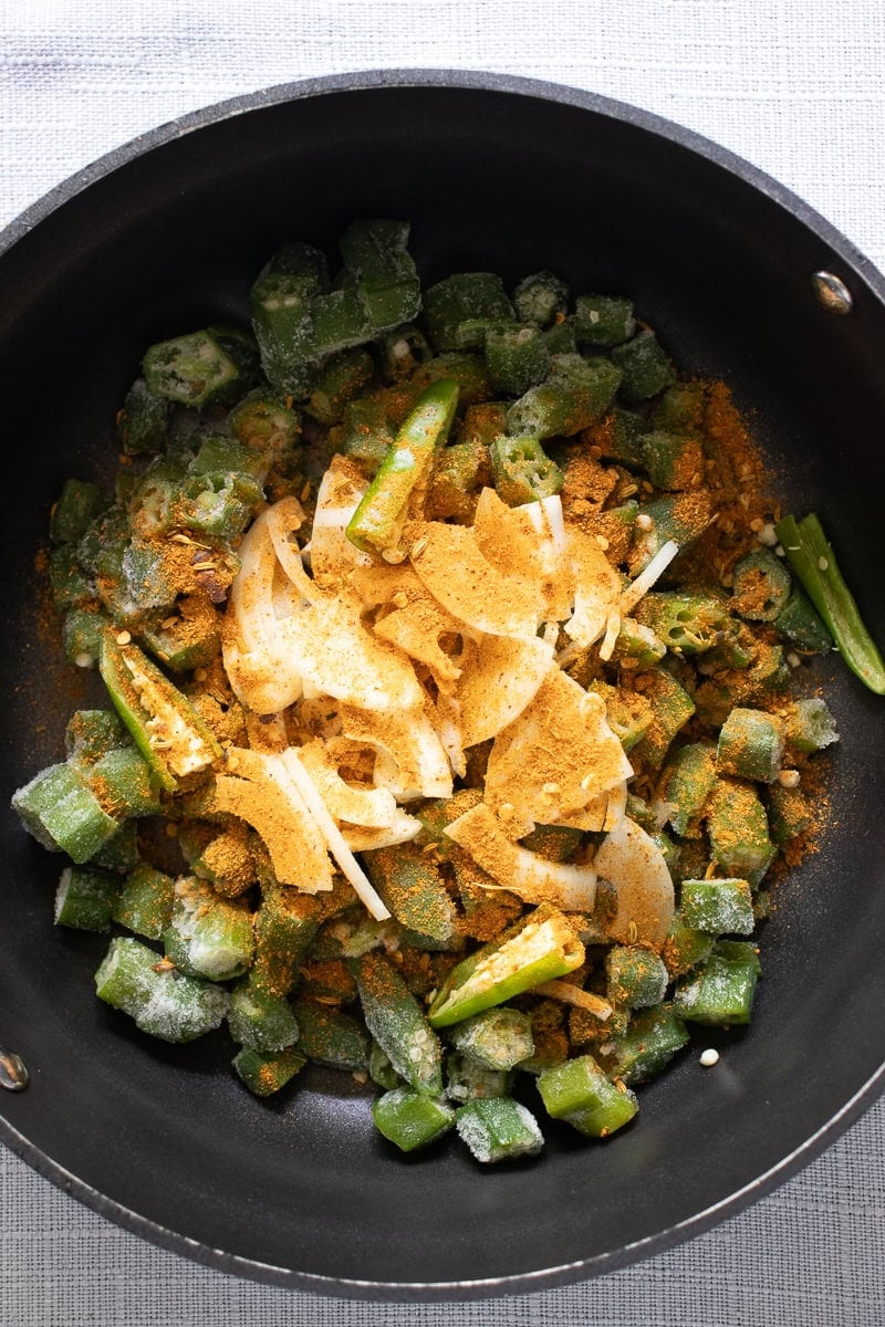 Achari Bhindi ingredients in a pot