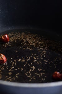 saute cumin and red chilies