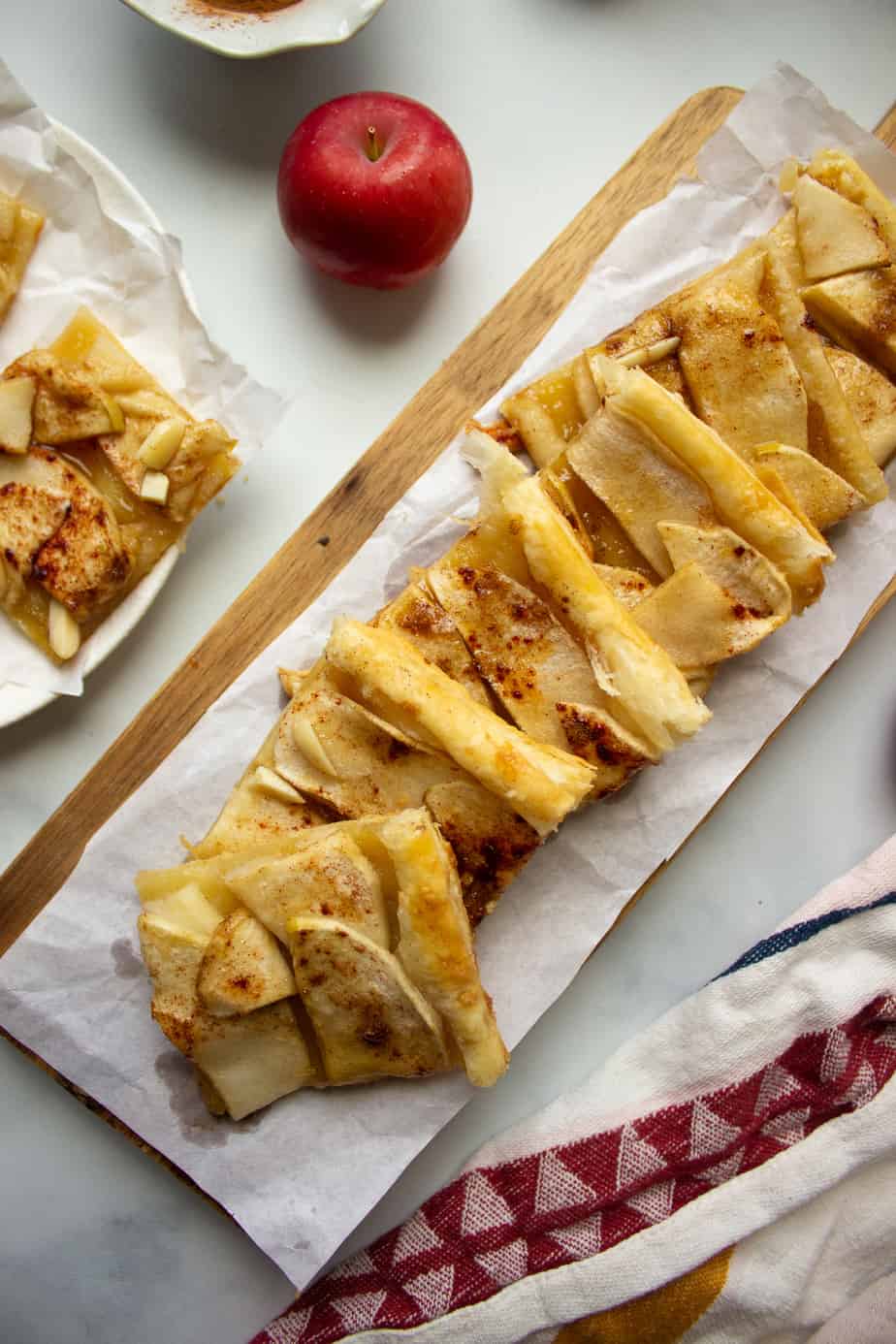 a long rectangular tray with apple tart squares