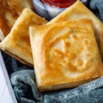 Box Patties in a metal tray with ketchup