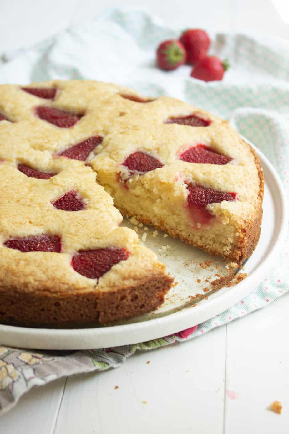 Strawberry cake with one piece missing