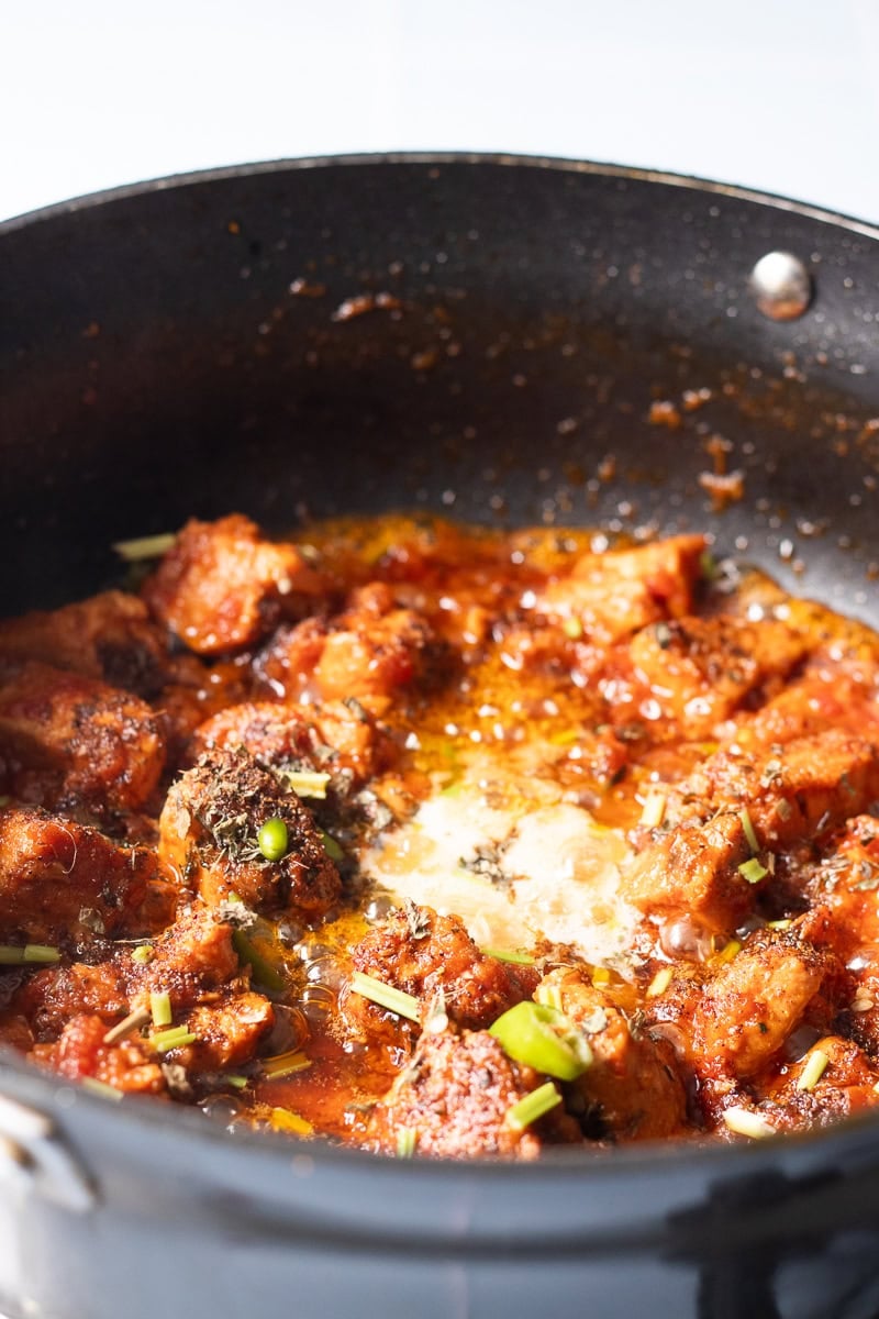 butter melting into the chicken masala