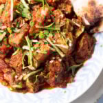 boneless chicken masala with a triangle of roti