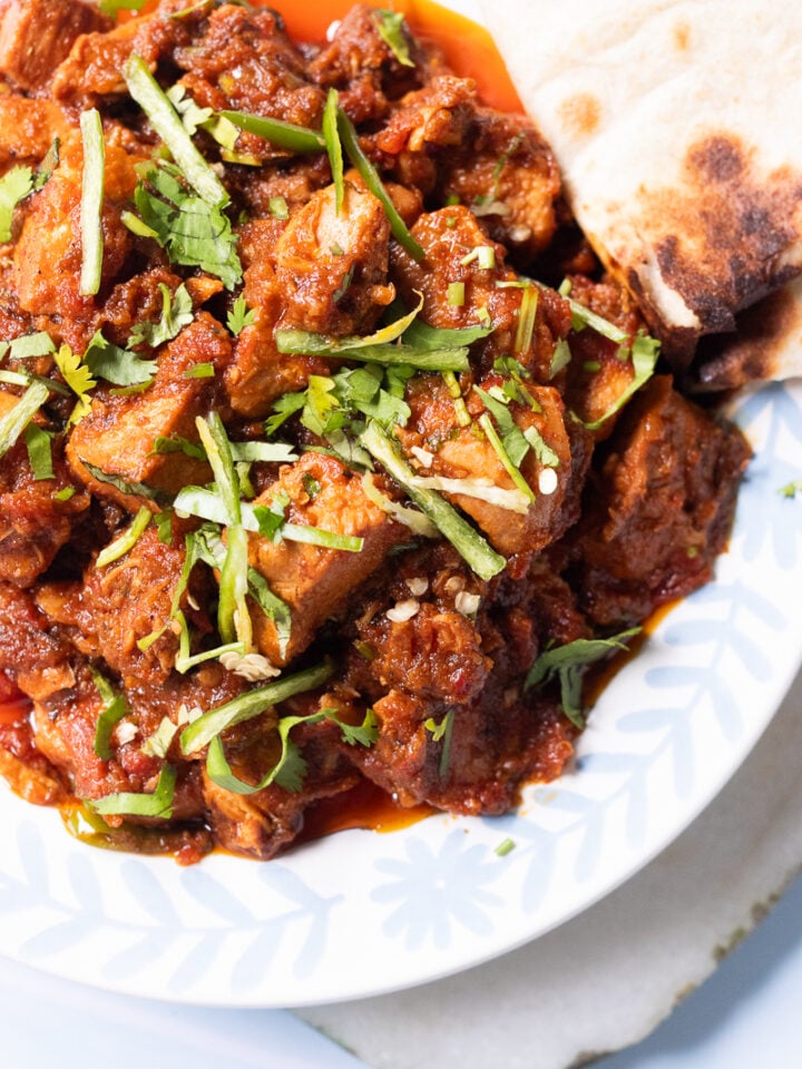 boneless chicken masala with a triangle of roti