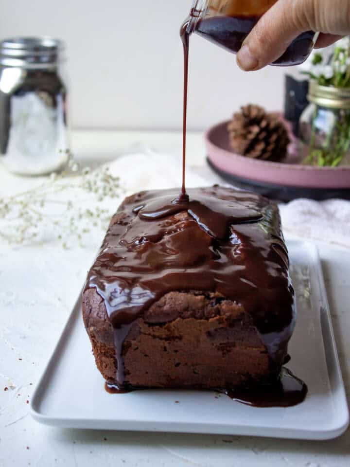 Glaze being poured on to a Chocolate Loaf Cake