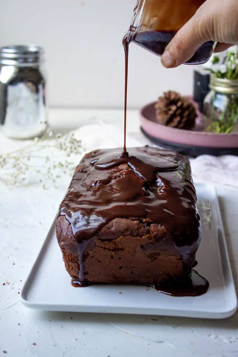 Glaze being poured on to a Chocolate Loaf Cake