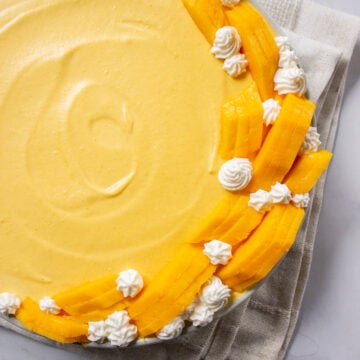 Easy Mango Mousse decorated with mangoes and whipped cream