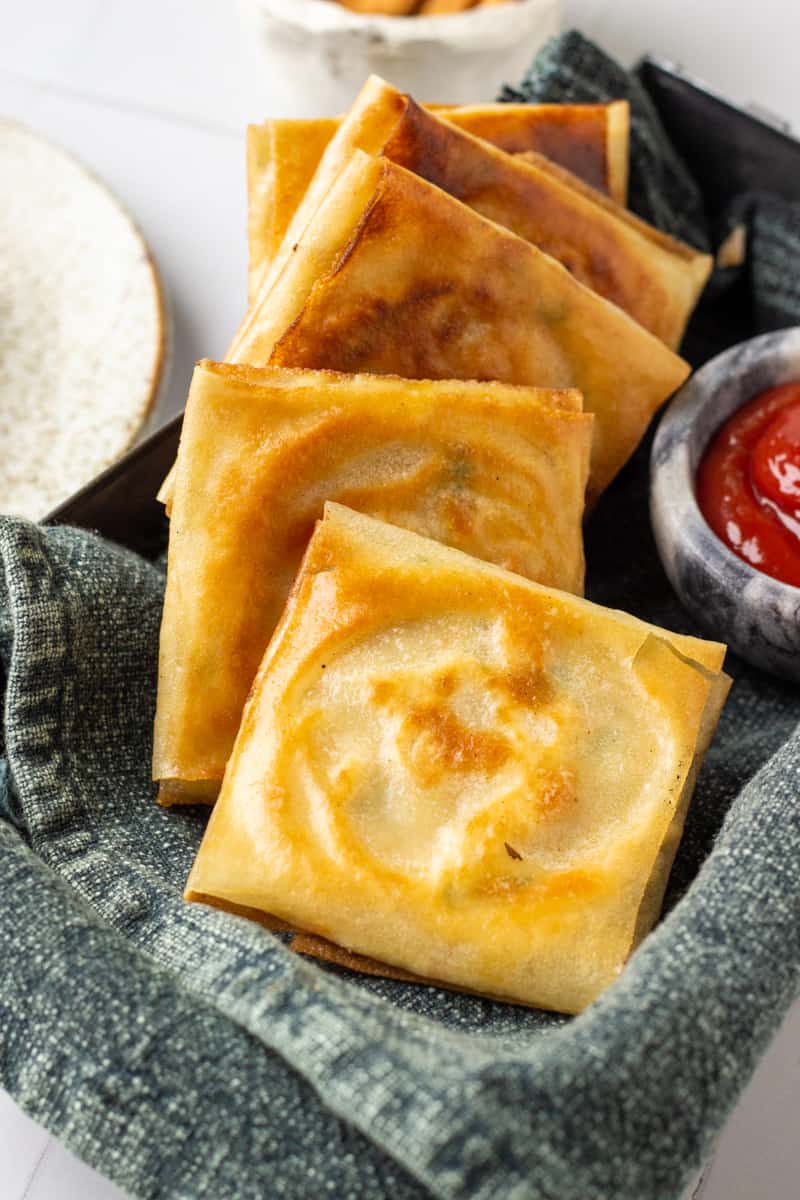 5 box patties in a tray with ketchup