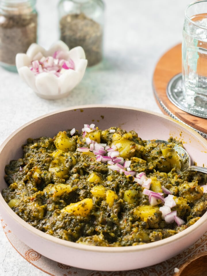 Quicker Aloo Palak in a pink dish