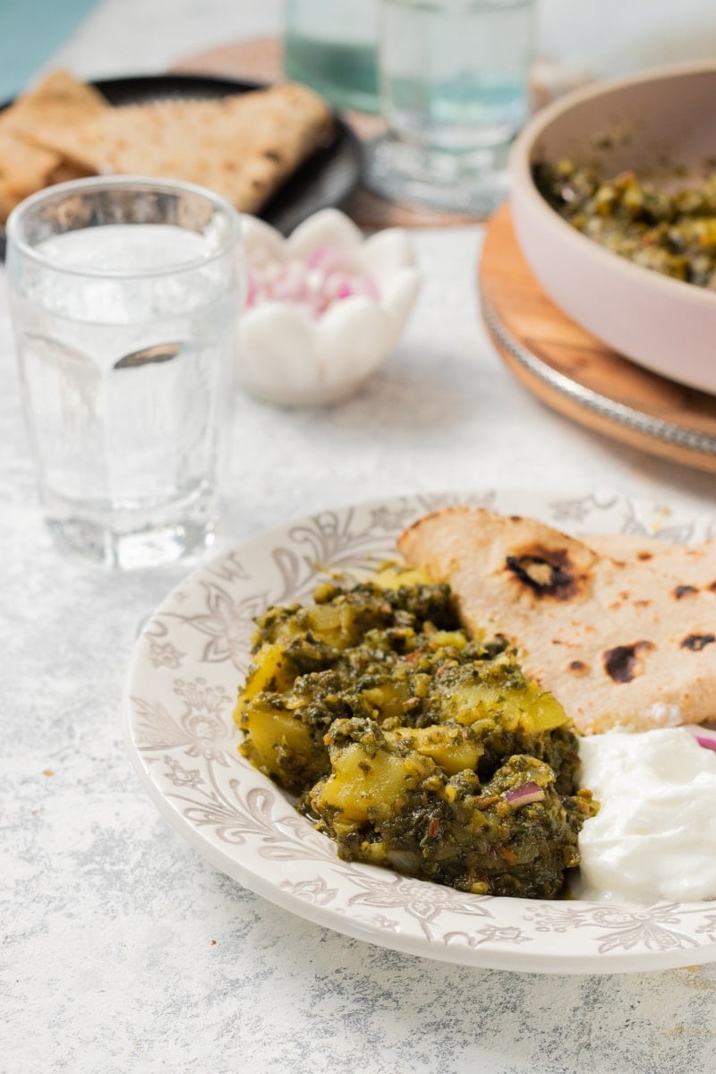 Aloo Palak, Dahi and Roti on a plate