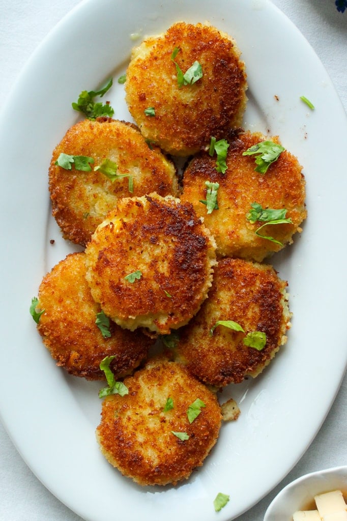 Top down view of Aloo Cutlets on an oval white platter