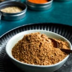 Pakistani Chaat Masala mix in a bowl, spices in background