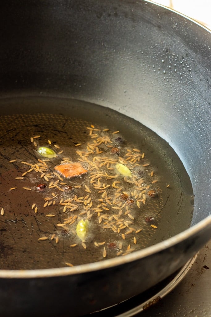 whole spices cooking in oil