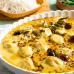 Kadhi Pakora in a dish, rice in the background