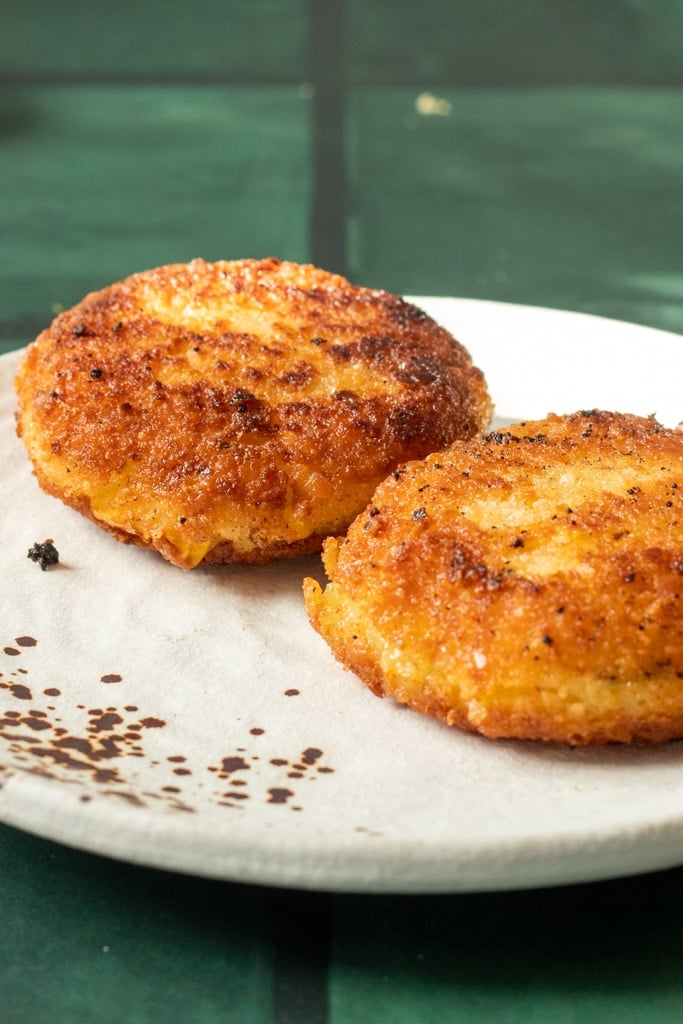 two potato cutlets on a plate