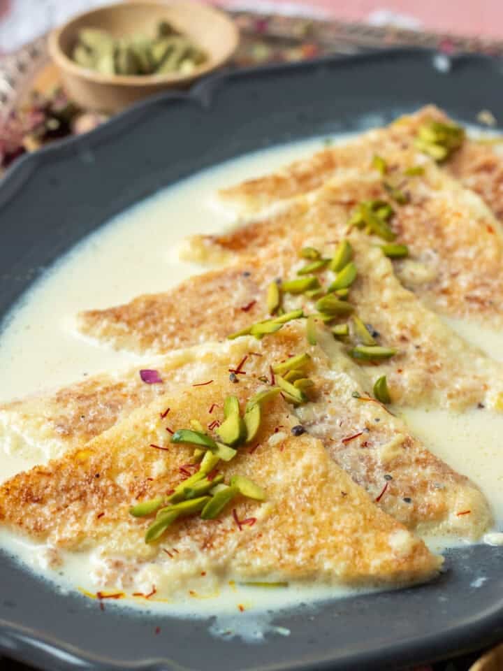 Shahi Tukray on a plate garnished with pistachios