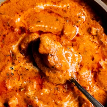 Close up of a dish of Chicken Handi with a spoon in it
