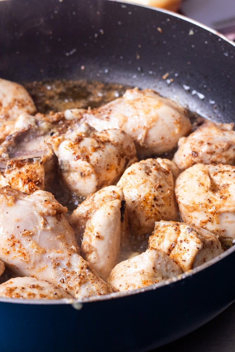 chicken and spices added to oil base