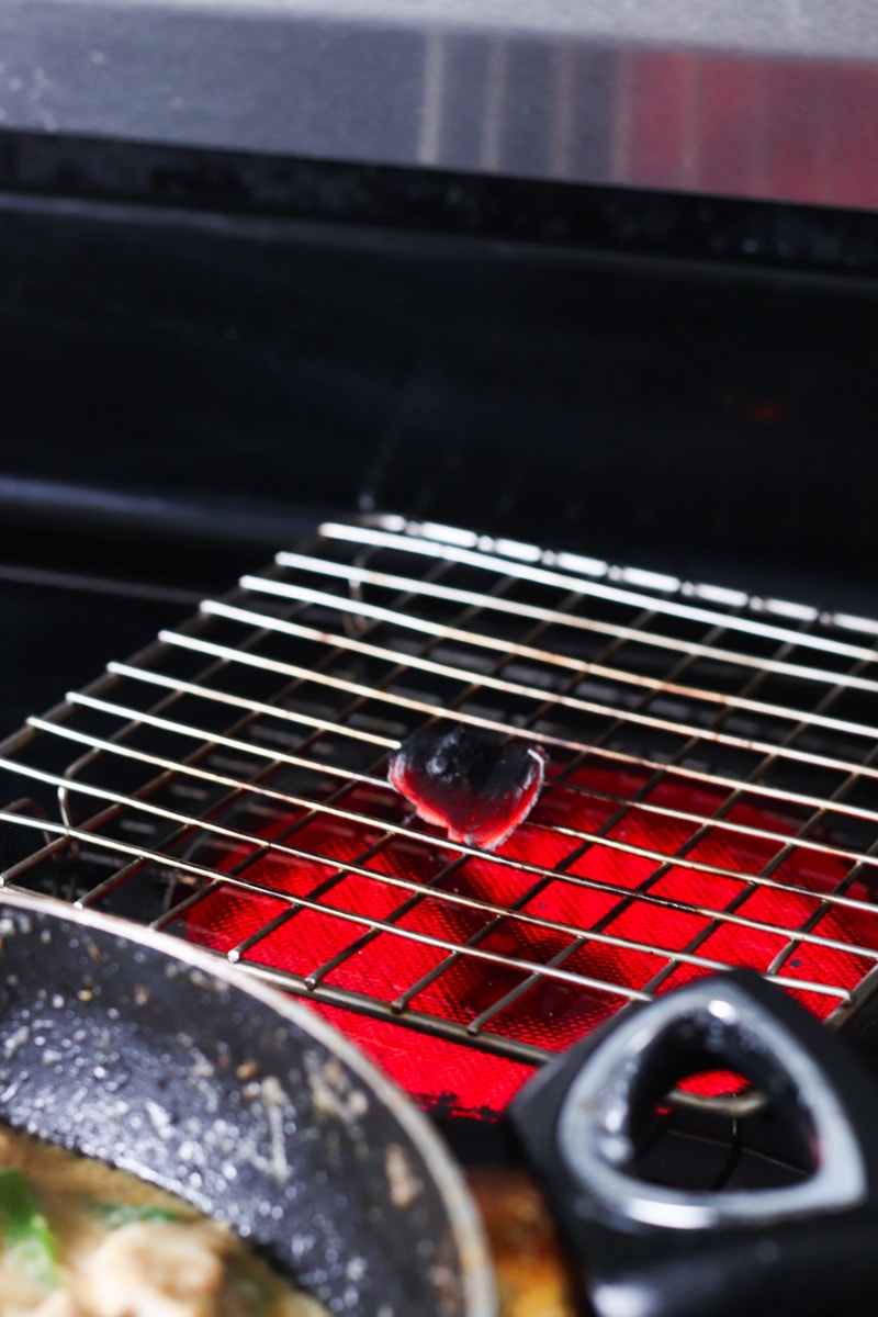 a piece of charcoal turning bright red