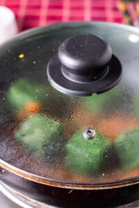 spinach defrosting in palak paneer masala