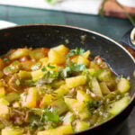 aloo shimla mirch or aloo capsicum sabzi in a wok
